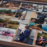 Joe Carr, a 32-year-old resident of Sedalia, Missouri, has a bar top outside his home plastered with photos of him and his grandfather taken around the family farm. Joe and his grandfather had a very close relationship. The relationship is one of the forces driving Joe to save the legacy of the family farm that he works on this day, Sept. 26, 2023.