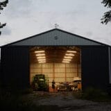 After a long day on Sept. 26, 2023, Joe Carr, 32, combines his farming and automotive repair job by repairing the tractors on the family farm.