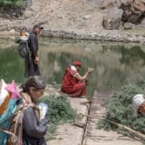 Head lama performs trüchu water blessing during the Bungkhor ceremony in Nang Village.